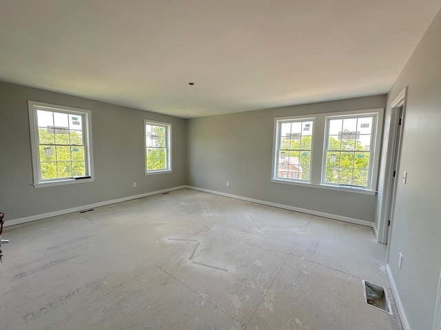 unfurnished room with plenty of natural light