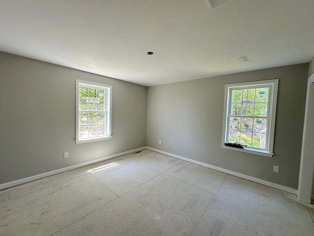 spare room featuring plenty of natural light