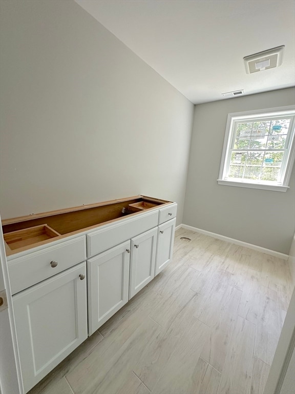 bathroom with wood-type flooring