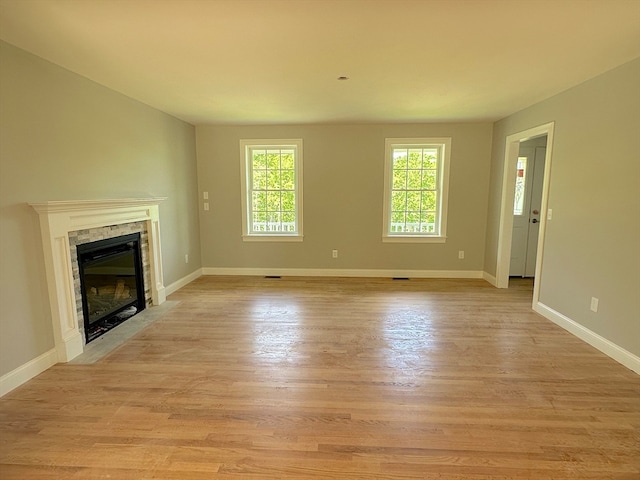 unfurnished living room featuring light hardwood / wood-style floors