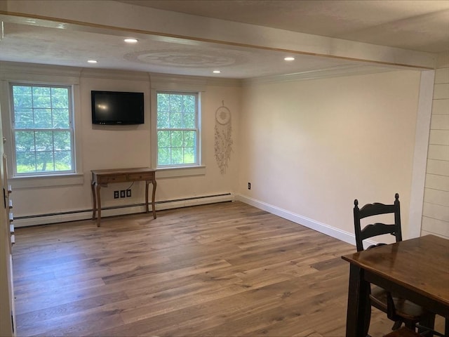 337 Mason Rd, Dudley, MA 01571 - unfurnished dining area featuring a baseboard radiator, crown molding, wood finished floors, and recessed lighting