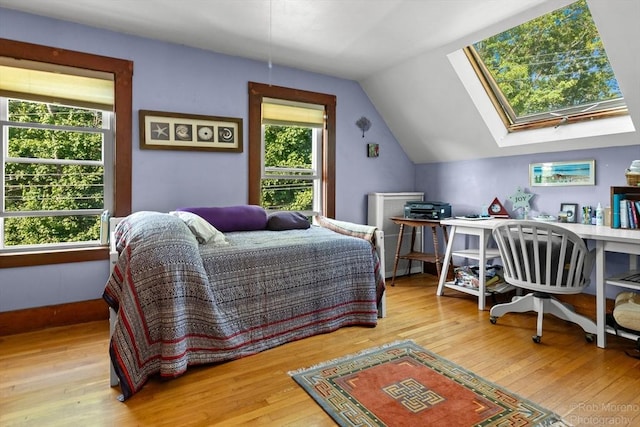 11 Hickory St, Gloucester, MA 01930 - bedroom featuring wood-type flooring, lofted ceiling, an office area, and a skylight