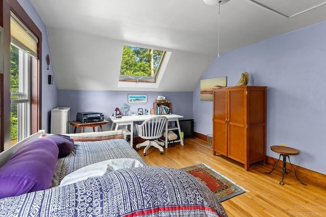 11 Hickory St, Gloucester, MA 01930 - bedroom featuring light wood-style flooring, a skylight, and lofted ceiling