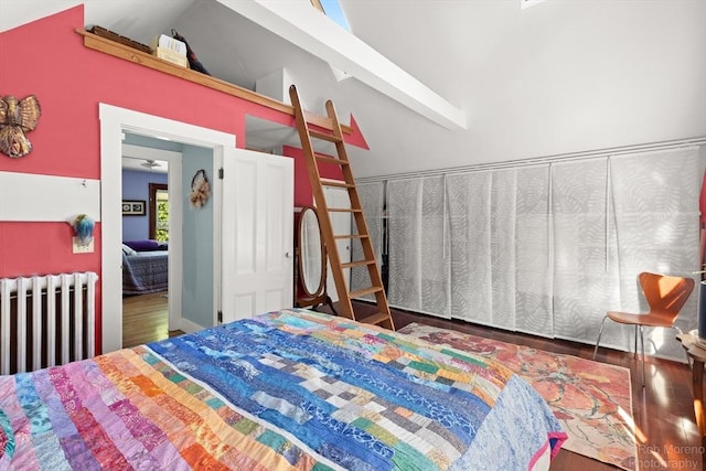11 Hickory St, Gloucester, MA 01930 - bedroom with radiator heating unit, wood finished floors, and high vaulted ceiling