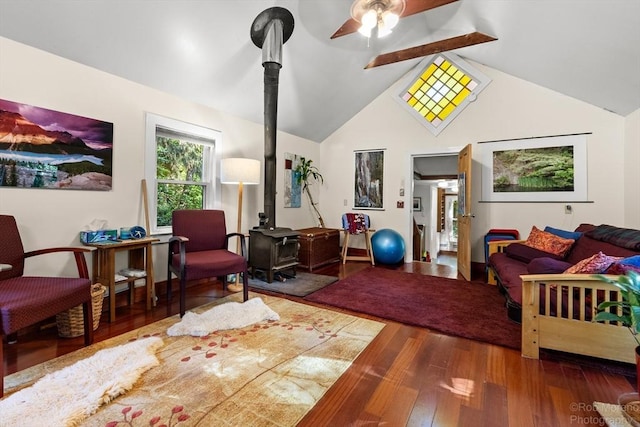 11 Hickory St, Gloucester, MA 01930 - living area featuring a wood stove, wood finished floors, ceiling fan, and high vaulted ceiling