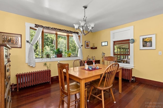 11 Hickory St, Gloucester, MA 01930 - dining room featuring radiator heating unit, a chandelier, and hardwood / wood-style floors