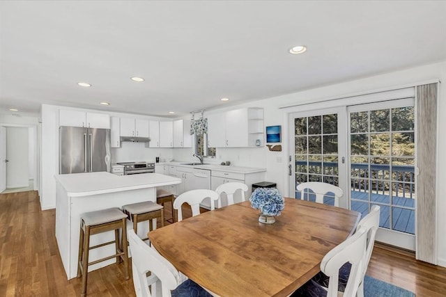 dining space featuring recessed lighting and wood finished floors