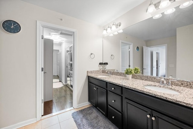 19 Locust Ln Unit 19, Hopkinton, MA 01748 - bathroom with double vanity, tile patterned flooring, and baseboards