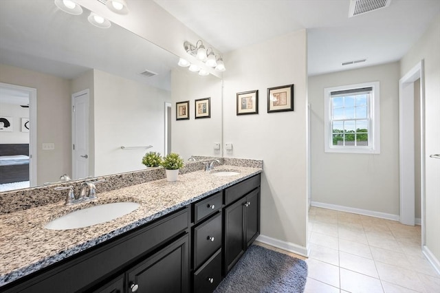 19 Locust Ln Unit 19, Hopkinton, MA 01748 - bathroom featuring double vanity, baseboards, and tile patterned flooring