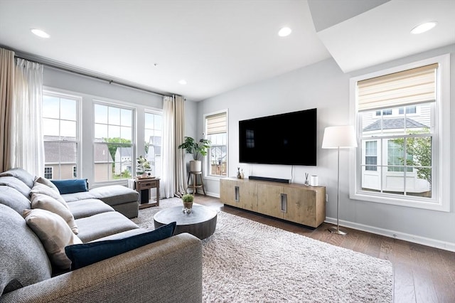 19 Locust Ln Unit 19, Hopkinton, MA 01748 - living area featuring plenty of natural light, wood finished floors, baseboards, and recessed lighting