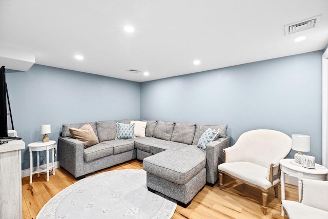 living area featuring visible vents, recessed lighting, and light wood-style floors