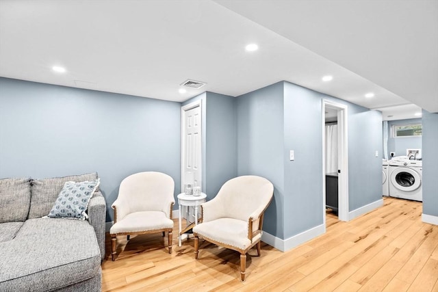 sitting room with visible vents, baseboards, recessed lighting, separate washer and dryer, and light wood-type flooring