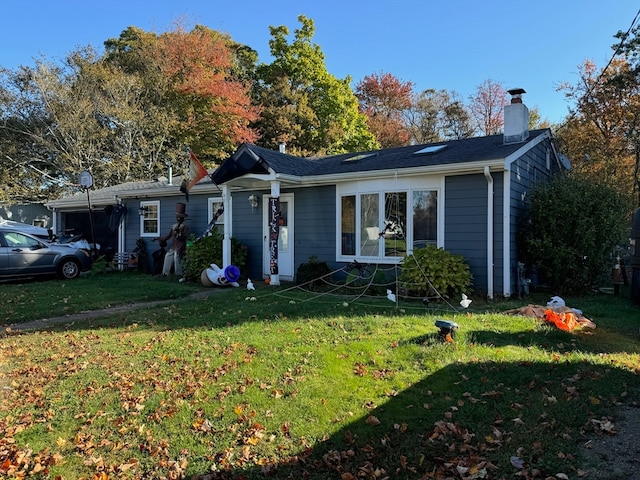 ranch-style home featuring a front yard