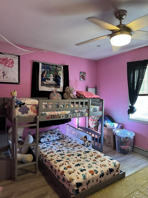 bedroom with ceiling fan and wood-type flooring