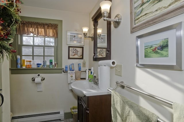 bathroom with vanity and a baseboard heating unit