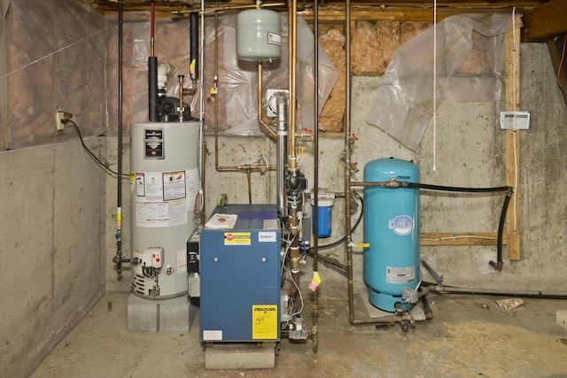 utility room featuring gas water heater