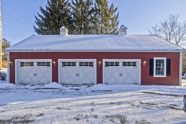 view of snow covered garage