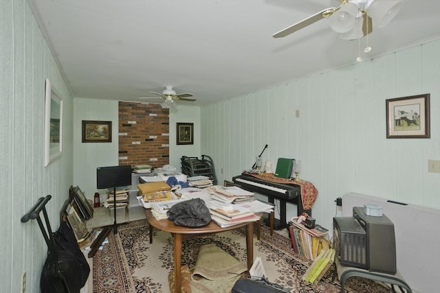 interior space with ceiling fan