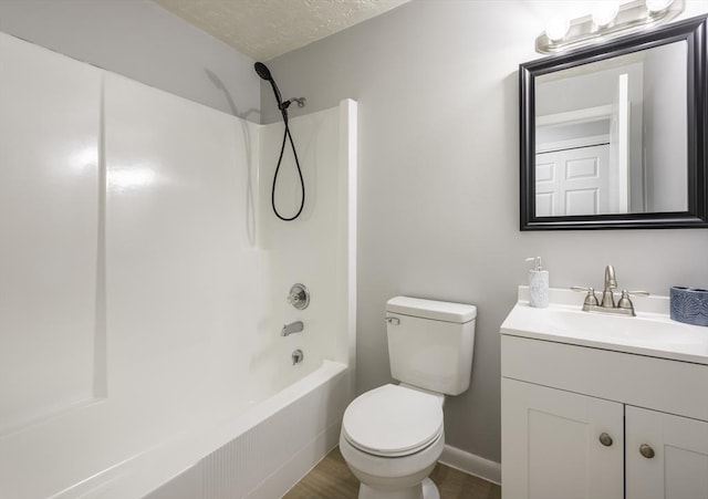 full bathroom with a textured ceiling, shower / tub combination, wood finished floors, vanity, and toilet