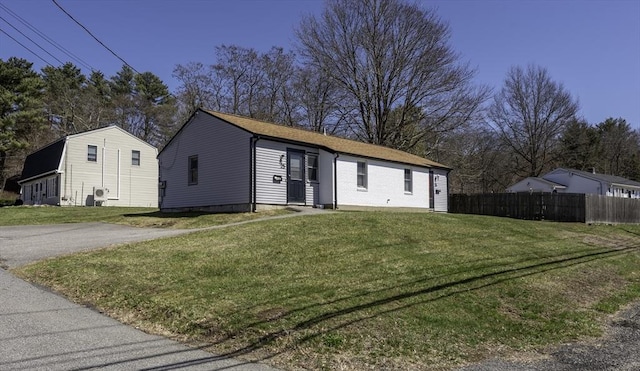 view of front of property with fence and a front yard
