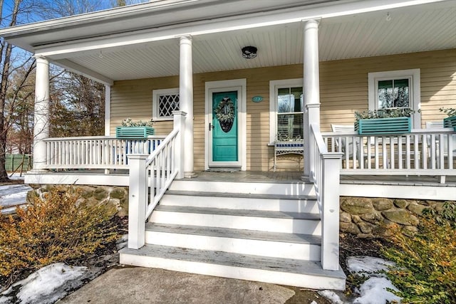 entrance to property featuring a porch