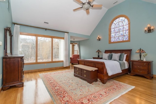 bedroom with vaulted ceiling, ceiling fan, and light hardwood / wood-style flooring