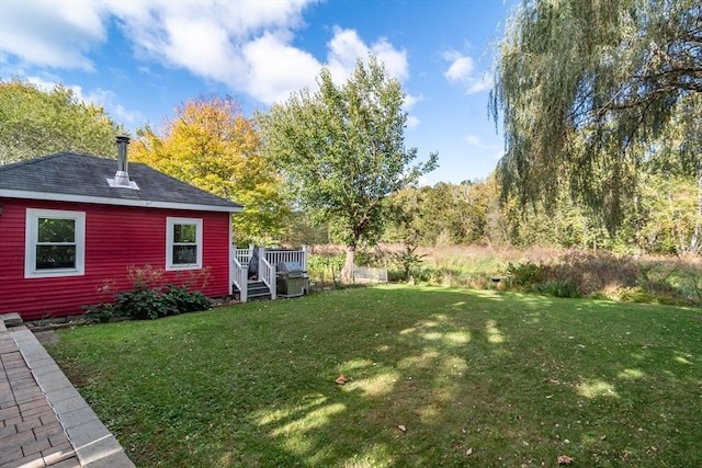 view of yard with a wooden deck