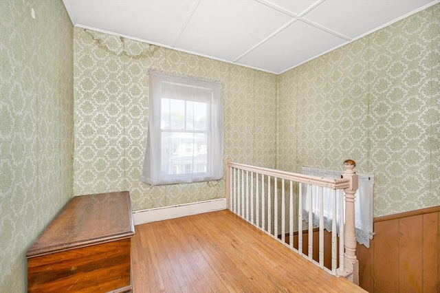 interior space with crown molding and hardwood / wood-style floors