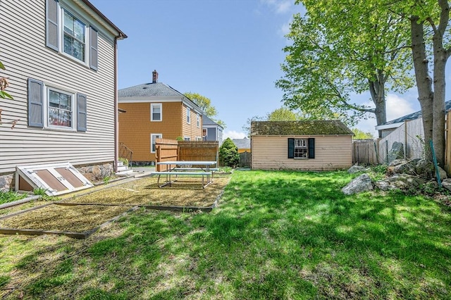 view of yard with a fenced backyard and an outdoor structure