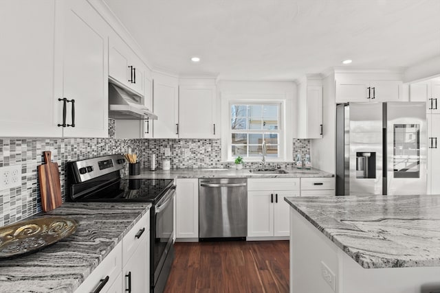 kitchen featuring sink, light stone countertops, dark hardwood / wood-style flooring, white cabinetry, and stainless steel appliances