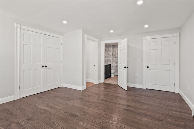 empty room with dark wood-type flooring