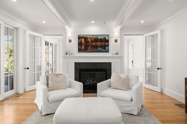 32 S Woodside Ave, Wellesley, MA 02482 - living room with french doors, ornamental molding, light wood-type flooring, a fireplace, and recessed lighting