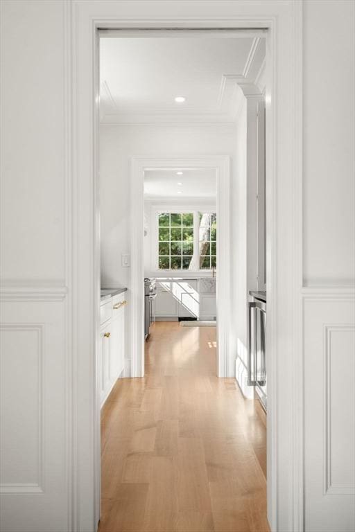 32 S Woodside Ave, Wellesley, MA 02482 - corridor featuring ornamental molding, a decorative wall, light wood-type flooring, and wainscoting