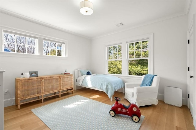 32 S Woodside Ave, Wellesley, MA 02482 - bedroom featuring ornamental molding and wood finished floors