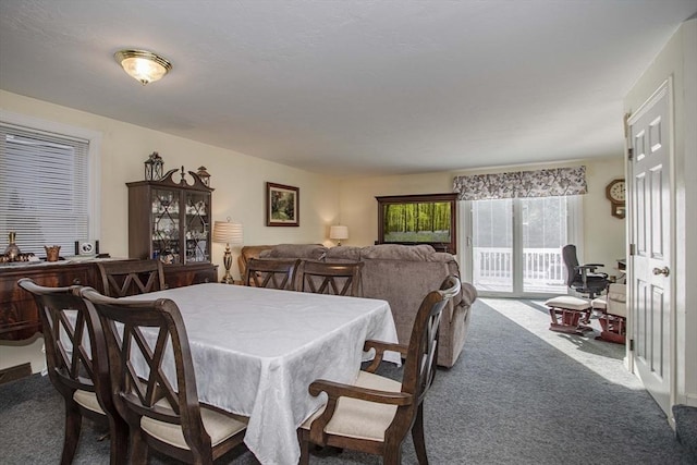 view of carpeted dining area