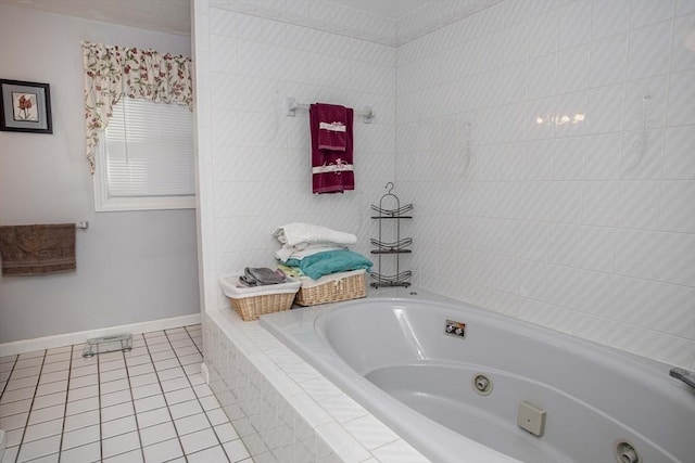 bathroom featuring a relaxing tiled tub and tile patterned floors