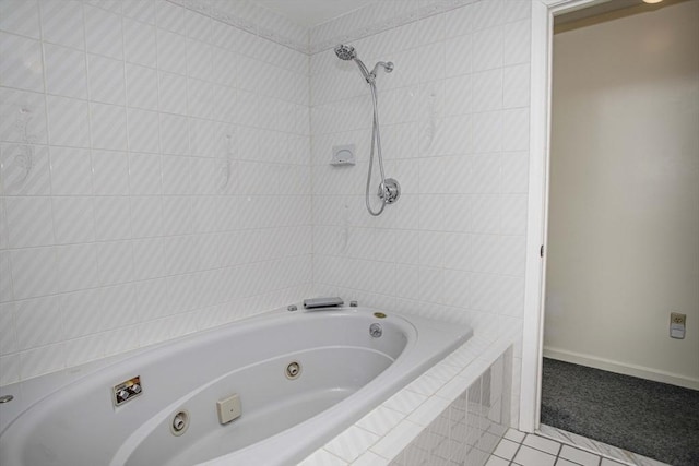 bathroom with tiled shower / bath combo and tile patterned flooring