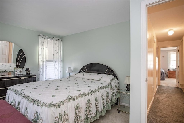 bedroom with light colored carpet