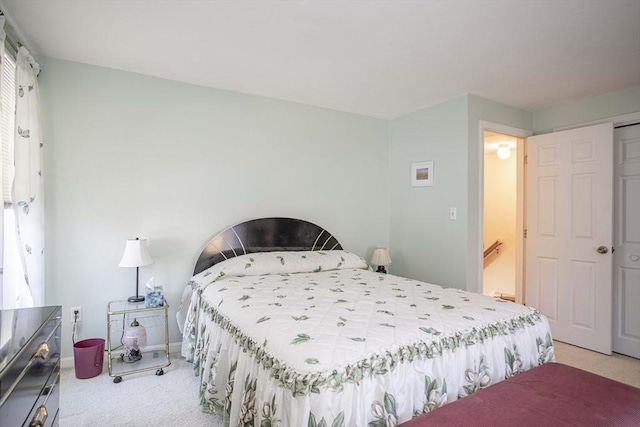 carpeted bedroom with a closet