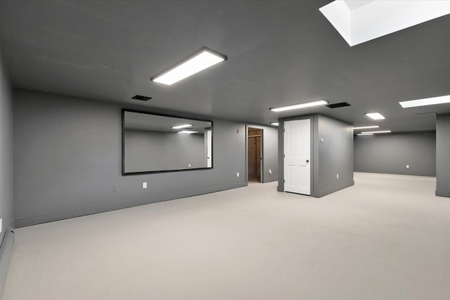 below grade area featuring baseboards and visible vents