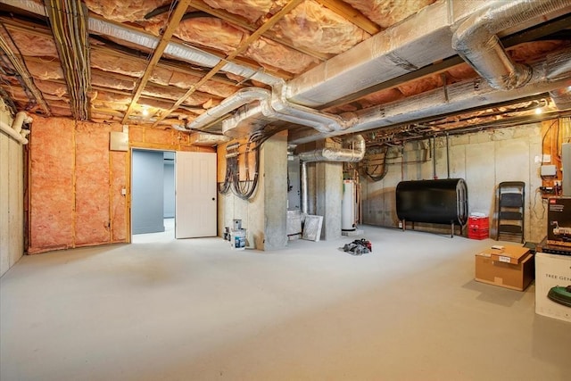 unfinished basement with heating fuel and water heater