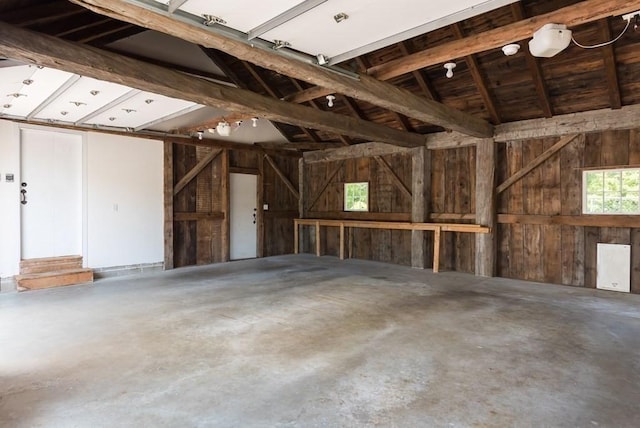 garage featuring wood walls