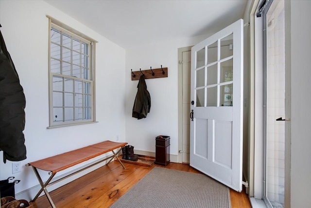 mudroom with baseboards and wood finished floors