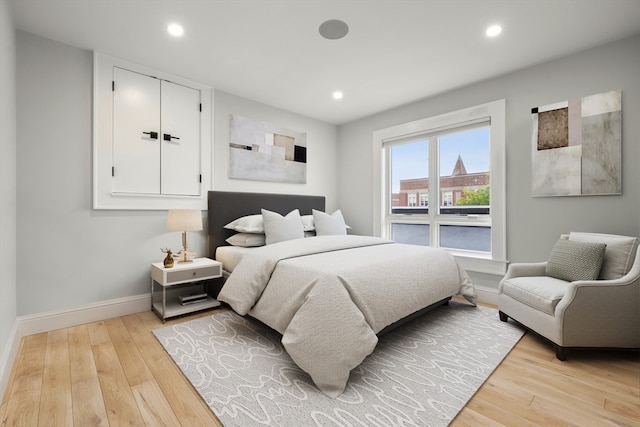 bedroom with light hardwood / wood-style floors