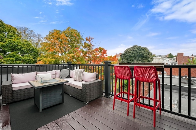 wooden terrace featuring outdoor lounge area