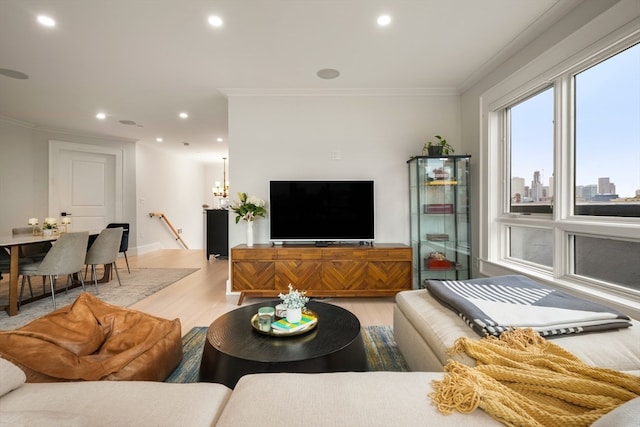 living room with light wood-type flooring and crown molding