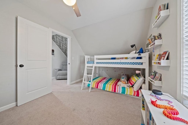 bedroom with ceiling fan, vaulted ceiling, and light carpet