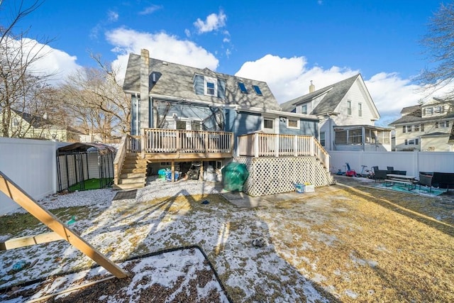 snow covered property featuring a wooden deck