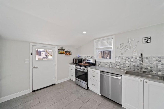 kitchen with white cabinetry, stainless steel appliances, sink, and plenty of natural light