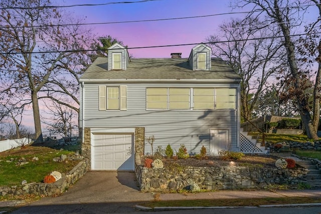 12 Babson St, Wakefield, MA 01880 - view of front of home featuring stairs, a garage, and asphalt driveway
